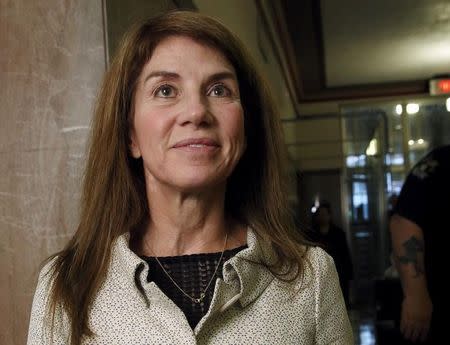 Sue Ann Hamm stands in the courthouse hall before divorce proceedings with Harold Hamm, founder and CEO of Continental Resources, in Oklahoma City, Oklahoma September 22, 2014. Picture taken September 22, 2014. REUTERS/Steve Sisney