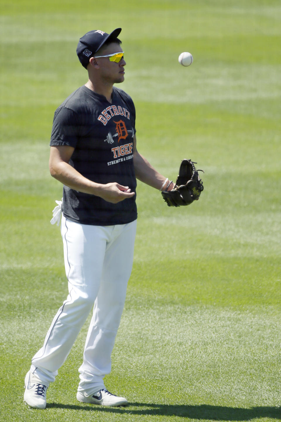 Detroit Tigers' JaCoby Jones flips a baseball during baseball training camp at Comerica Park, Friday, July 3, 2020, in Detroit. (AP Photo/Duane Burleson)