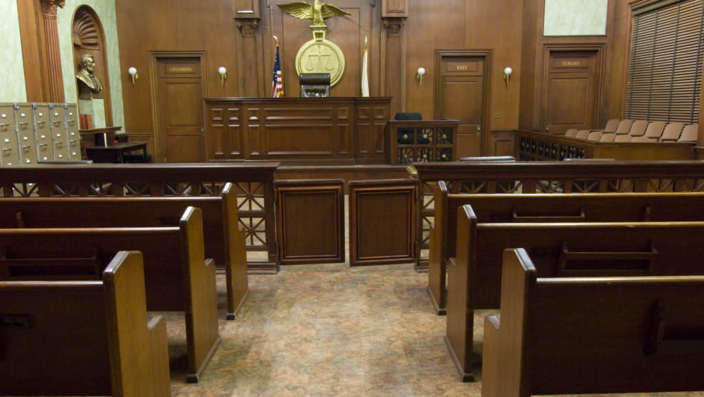 A view of a vacant courtroom toward the judge's bench