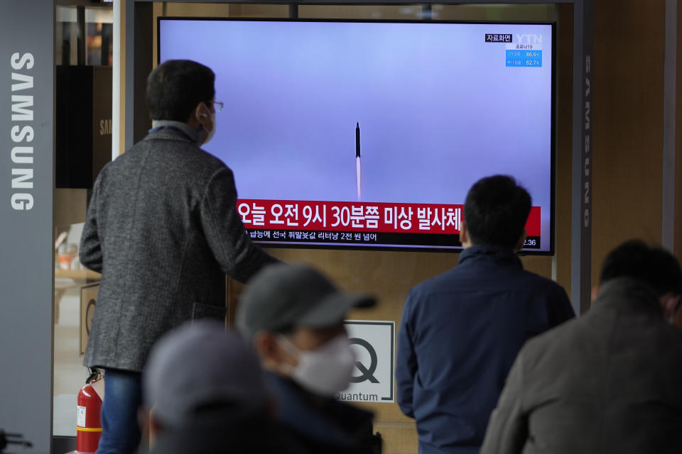 People watch a TV screen showing a news program reporting about North Korea's missile with file footage, at a train station in Seoul, South Korea, Wednesday, March 16, 2022. North Korea's latest weapons launch on Wednesday apparently ended in failure, South Korea' military said, amid speculation that the North could soon launch its biggest long-range missile in its most significant provocation in years. (AP Photo/Lee Jin-man)