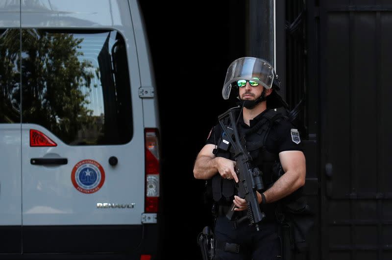 A police convoy believed to be carrying Rwandan genocide fugitive Felicien Kabuga arrives at the Paris courthouse