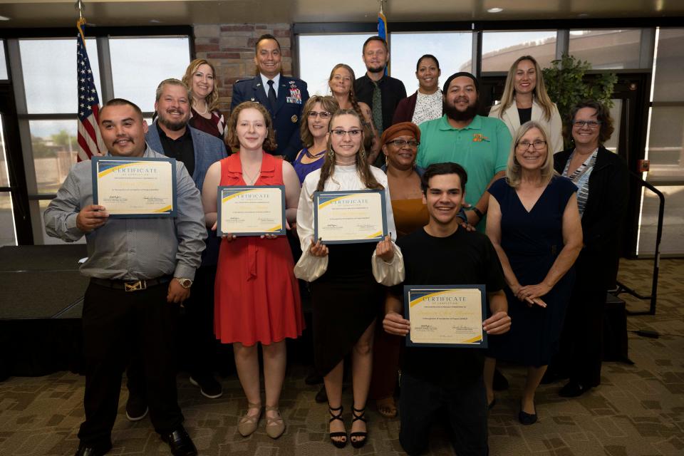 Project SEARCH stakeholders and graduates pose for a photo after a graduation ceremony at Holloman Air Force Base, New Mexico, Thursday May 18, 2023. Project SEARCH, a program that integrates 18-22 year olds with disabilities into working environments to help gain valuable work experience. Interns from left to right: Gabiel Porras, Ainsley Johnson, Terrah Rodriguez, Alex Montoya.