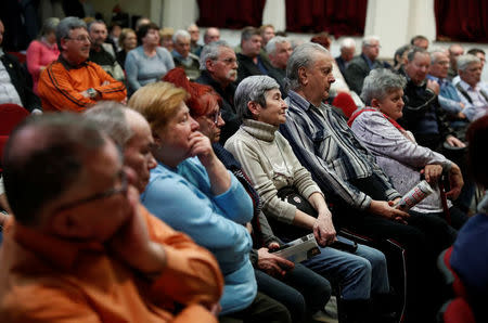 Voters listen to a speech by Fidesz candidate, Denes Galambos at a campaign forum of the right-wing party in Ercsi, Hungary, March 9, 2018. Picture taken March 9, 2018. REUTERS/Bernadett Szabo