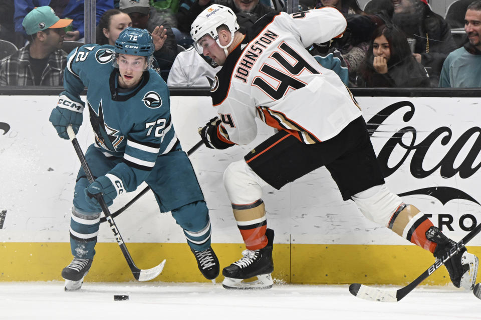 San Jose Sharks left wing William Eklund (72) is defended by Anaheim Ducks left wing Ross Johnston (44) during the first period of an NHL hockey game Saturday, Jan. 20, 2024, in San Jose, Calif. (AP Photo/Nic Coury)