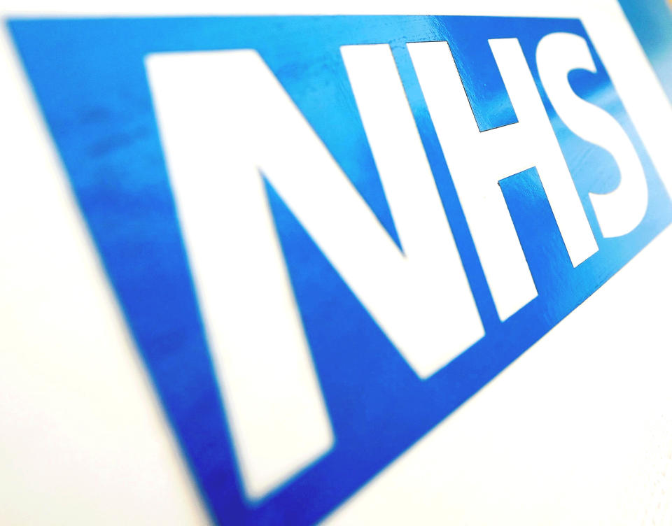 File photo dated 06/11/10 of the NHS logo. The record number of patients waiting for hospital treatment shows the "calamitous impact" of coronavirus on waiting times in England, a leading surgeon has said. New figures published on Thursday show that a total of 4.46 million people were waiting to start hospital treatment in England at the end of November 2020, the highest number since records began.