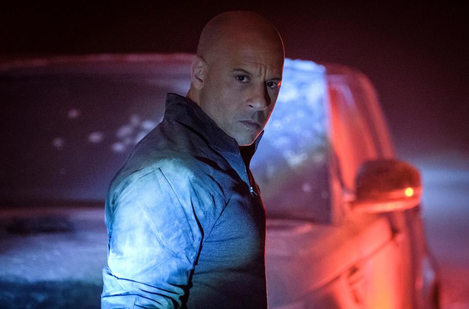 Super soldier Ray Garrison (Vin Diesel) fights mercenaries during a high-speed car chase in the action movie "Bloodshot."