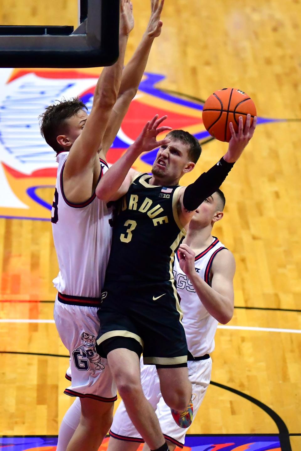 Nov 20, 2023; Honolulu, Hawaii, USA; 
Purdue Boilermakers guard Braden Smith (3) drives to the basket against Gonzaga Bulldogs guard Luka Krajnovic (3) and forward Ben Gregg (33) during the second quarter at SimpliFi Arena at Stan Sheriff Center.