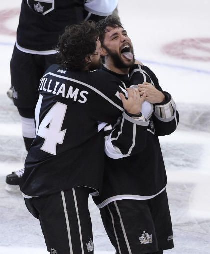 Los Angeles Kings right wing Justin Williams, left, celebrates with defenseman Alec Martinez. (AP Photo/Mark J. Terrill)