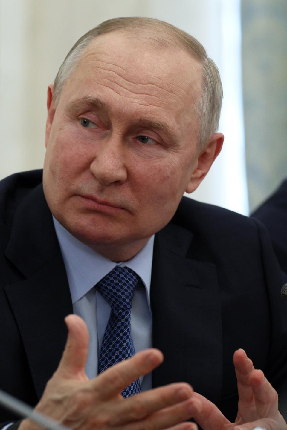 Russian President Vladimir Putin gestures while speaking during a meeting with Russian war correspondents who cover a special military operation, at the Kremlin in Moscow, Russia, Tuesday, June 13, 2023. (Gavriil Grigorov/Sputnik, Kremlin Pool Photo via AP)