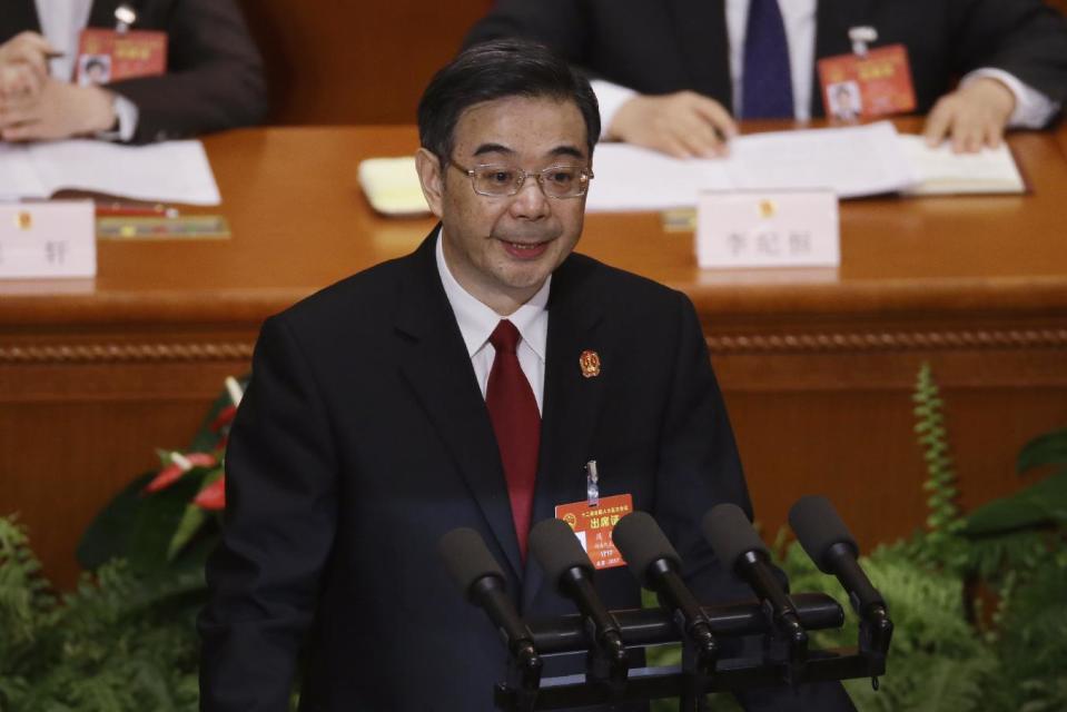 China's Chief Justice Zhou Qiang delivers a speech during a plenary session of the National People's Congress at the Great Hall of the People in Beijing, Sunday, March 12, 2017. Zhou said Sunday that his country, which is believed to execute more people than the rest of the world combined, gave the death penalty "to an extremely small number of criminals for extremely serious offenses" in the past 10 years. (AP Photo/Andy Wong)