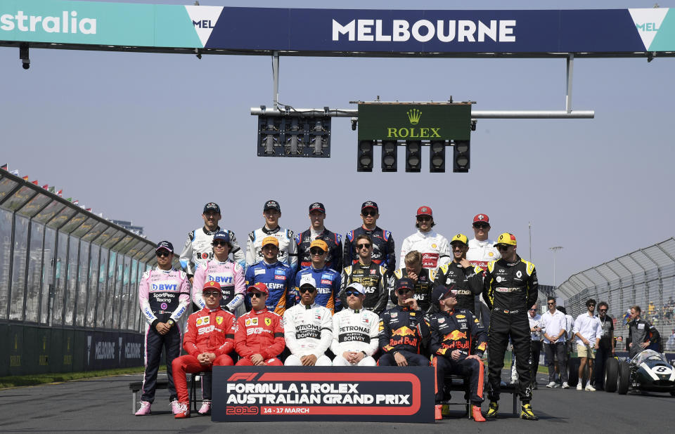 In this March 17, 2019, file photo, drivers pose for a group photo ahead of the Australian Formula 1 Grand Prix in Melbourne, Australia. The start of the Formula One season has been delayed after the Australian Grand Prix was postponed because of the coronavirus pandemic. The Australian race in Melbourne has been rescheduled from March 21 to November 21. (AP Photo/Andy Brownbill, File)