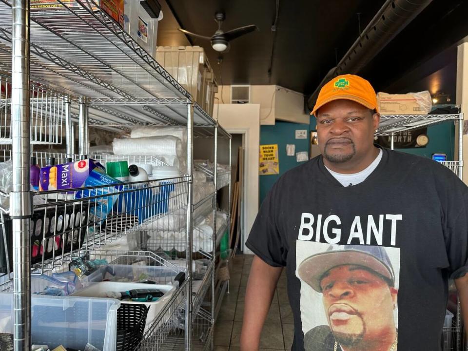 Anthony Nelson stands inside of Street Help on Wyandotte Street in Windsor. The area is supposed to be used for clients to come in and sit down, instead it's being used to store donation items. (Jennifer La Grassa/CBC - image credit)