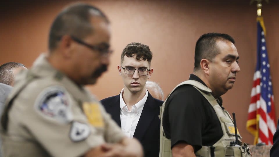 Patrick Crusius, the gunman in the El Paso Walmart shooting, is seen, center, in this file photo from October 2019. - Briana Sanchez/AP