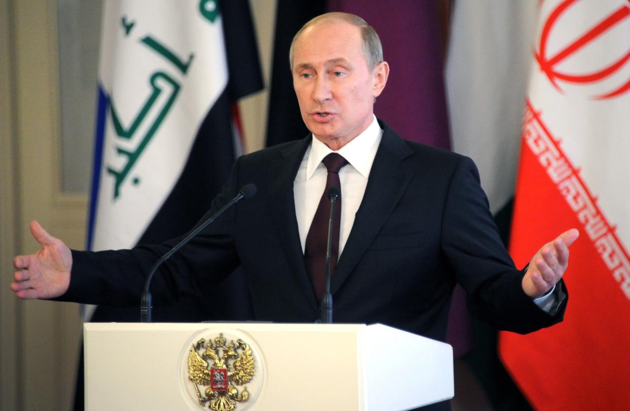 Russia's President Vladimir Putin speaks during his press conference at the Kremlin in  Moscow, on July 1, 2013. Putin said today that his country had never extradited anyone before and added that US leaker Edward Snowden could remain in Moscow if he stopped issuing his leaks. (Alexander Nemenov/AFP via Getty Images)