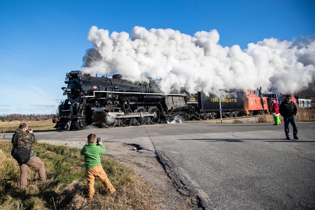 The North Pole Express, pulled by steam engine Pere Marquette 1225, travels toward Ashley from Owosso on Friday, Nov. 24, 2023.