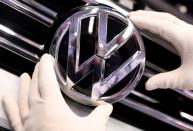 A Volkswagen logo is pictured in a production line at the Volkswagen plant in Wolfsburg