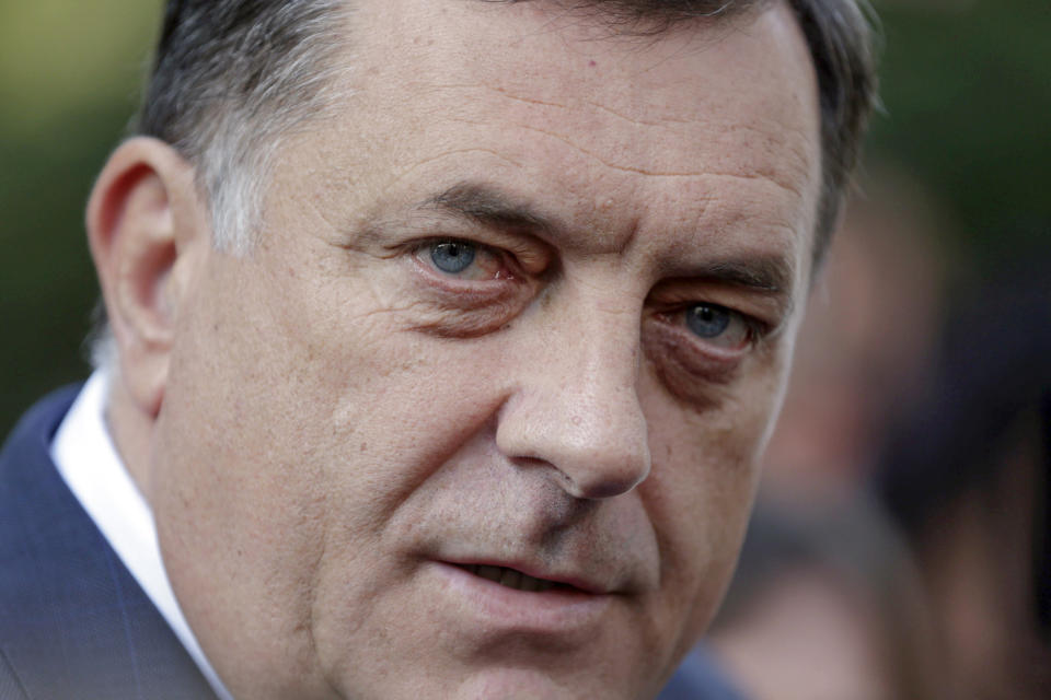 FILE- Bosnian Serb leader Milorad Dodik exits a poling station after he cast votes on referendum in the Bosnian town of Laktasi, Bosnia, on Sept. 25, 2016. Long-reigning Bosnian Serb leader, Milorad Dodik, has grown increasingly hostile this week as the West turned up the pressure on him to stop a spiraling secessionist campaign in his multiethnic Balkan country of 3.3 million people that has never truly recovered from its fratricidal 1992-95 war. (AP Photo/Amel Emric, File)