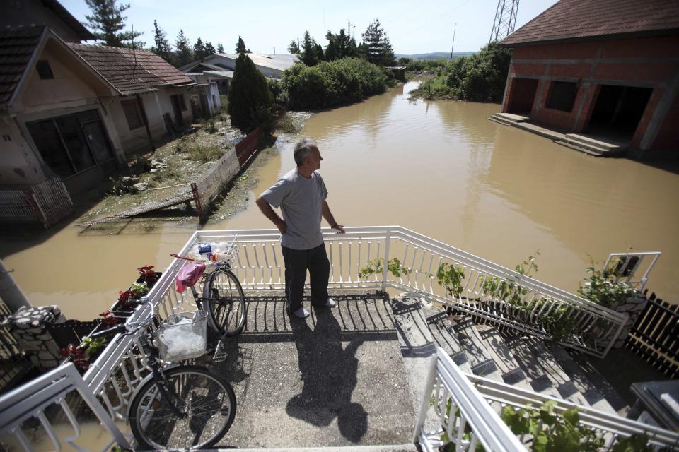 Man looks at flood waters in the town of Smedarevska Palanka