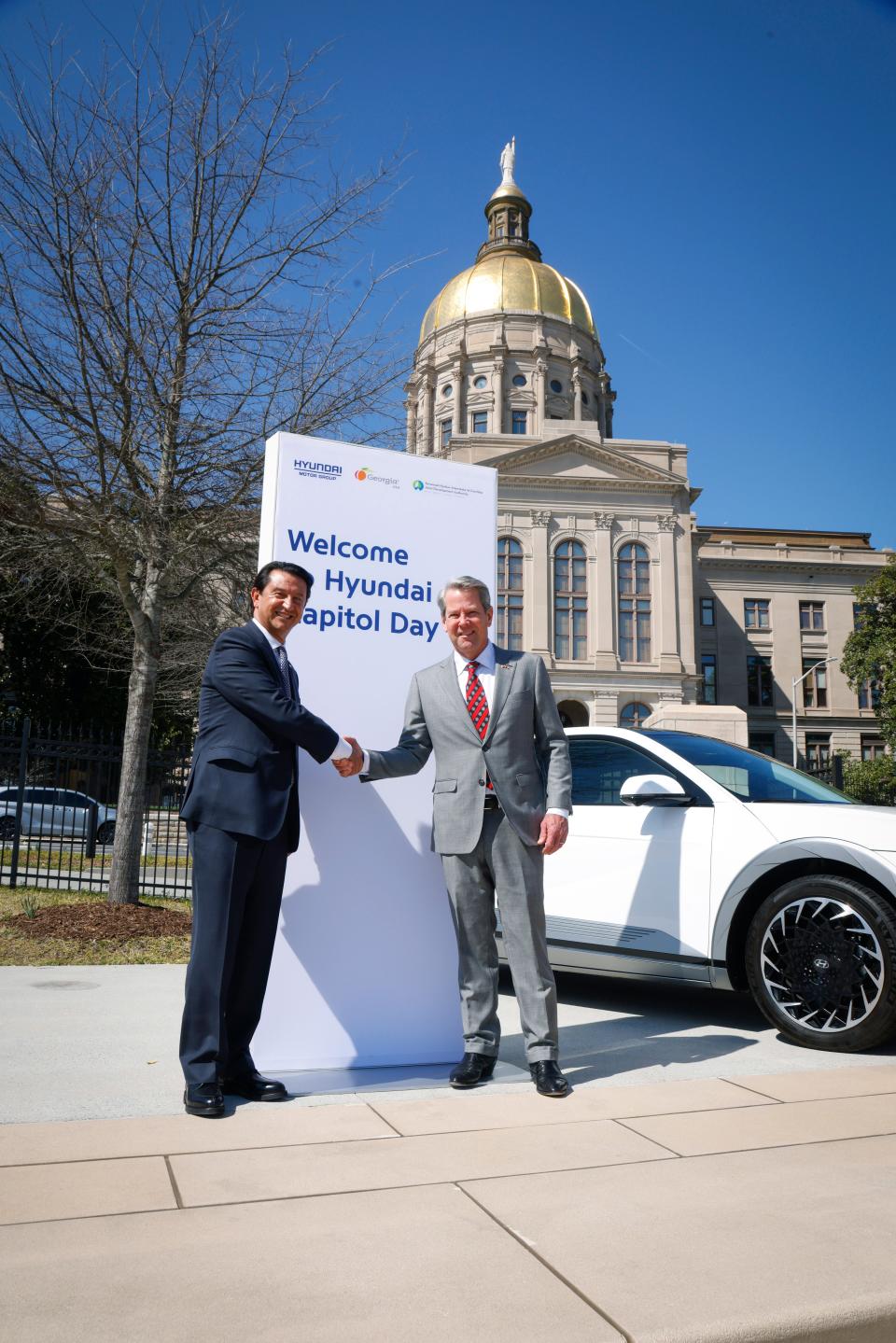 Georgia Governor Brian Kemp (right) and José Muñoz, president and global COO, Hyundai Motor Company, and president and CEO, pose in front of the Georgia State Capitol on Feb. 26, 2024 as part of Hyundai Day.