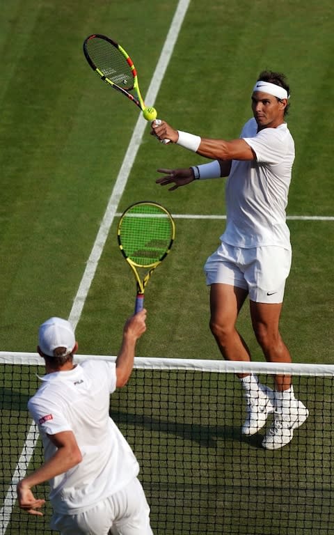 Querrey and Nadal duel at the net - Credit: REX