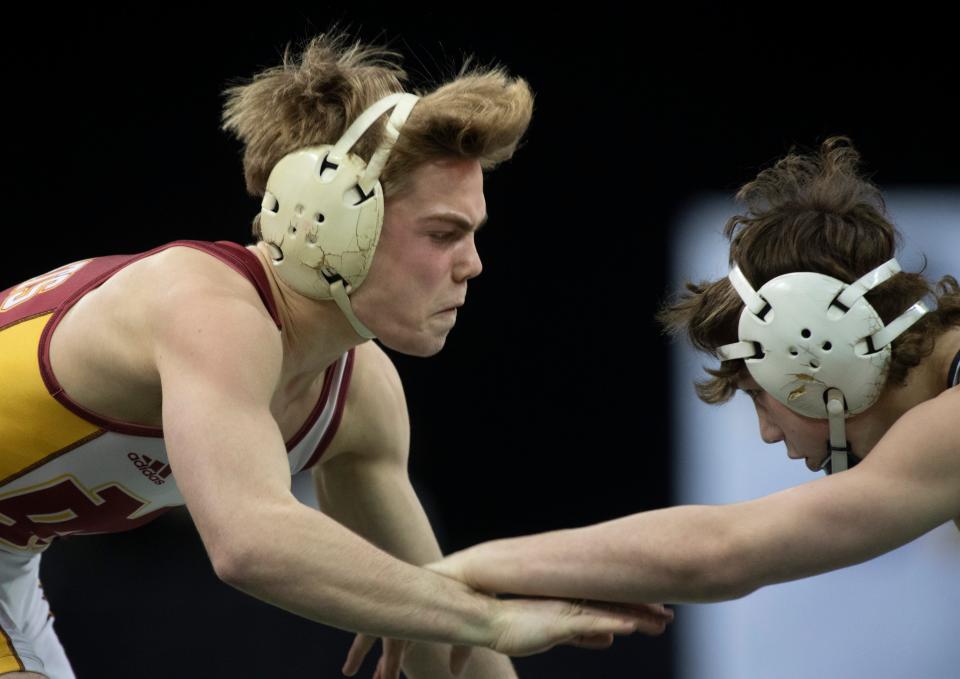 Jake Hockaday of Brownsburg wresltes Isaiah Schaefer of Evansville Mater Dei in the 120-pound championship match of the 2023 IHSAA Semistate Wrestling tournament at Ford Center in Evansville, Ind., Saturday, Feb. 11, 2023. 