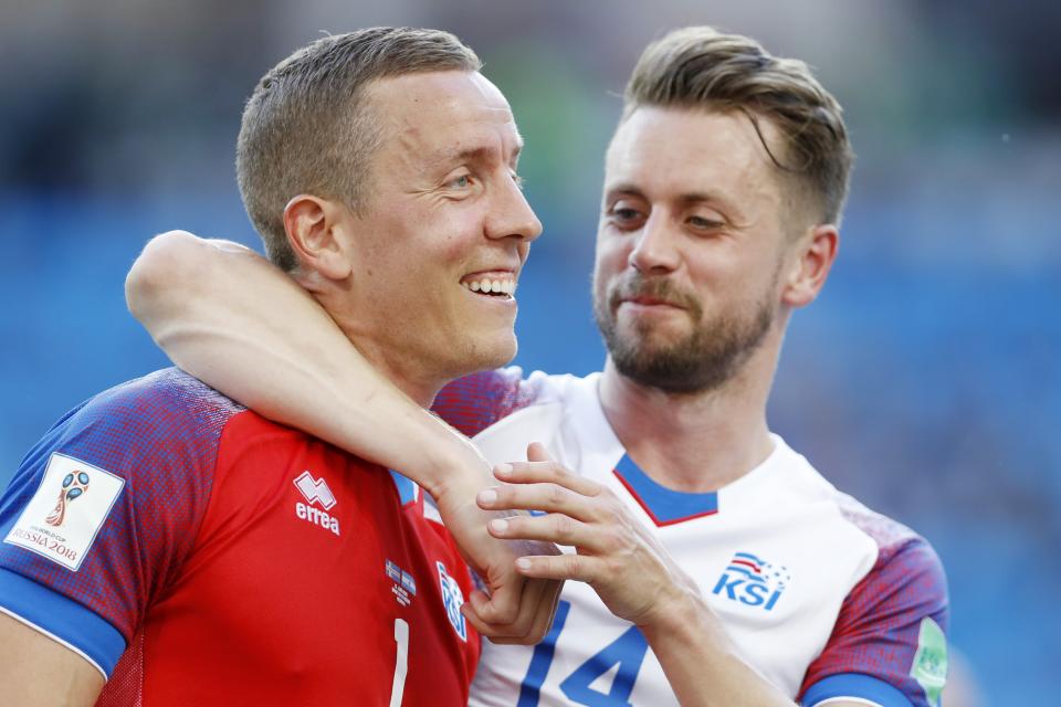 <p>Cheers, mate! Two of Iceland’s heroes give themselves a well-deserved pat on the back </p>