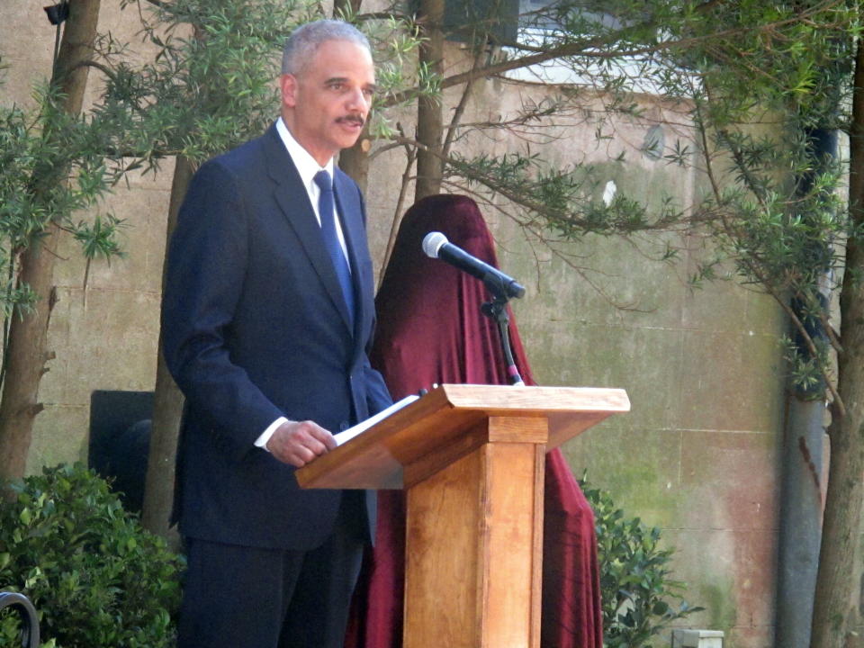 U.S. Attorney General Eric Holder speaks during the dedication of a statue of U.S. District Judge Waties Waring outside the federal courthouse in Charleston, S.C., on Friday, April 11, 2014. Holder said, Waring, the first federal judge to write an opinion challenging separate but equal decades after the policy was declared the law by the U.S. Supreme Court, was morally right and historically gutsy. (AP Photo/Bruce Smith)