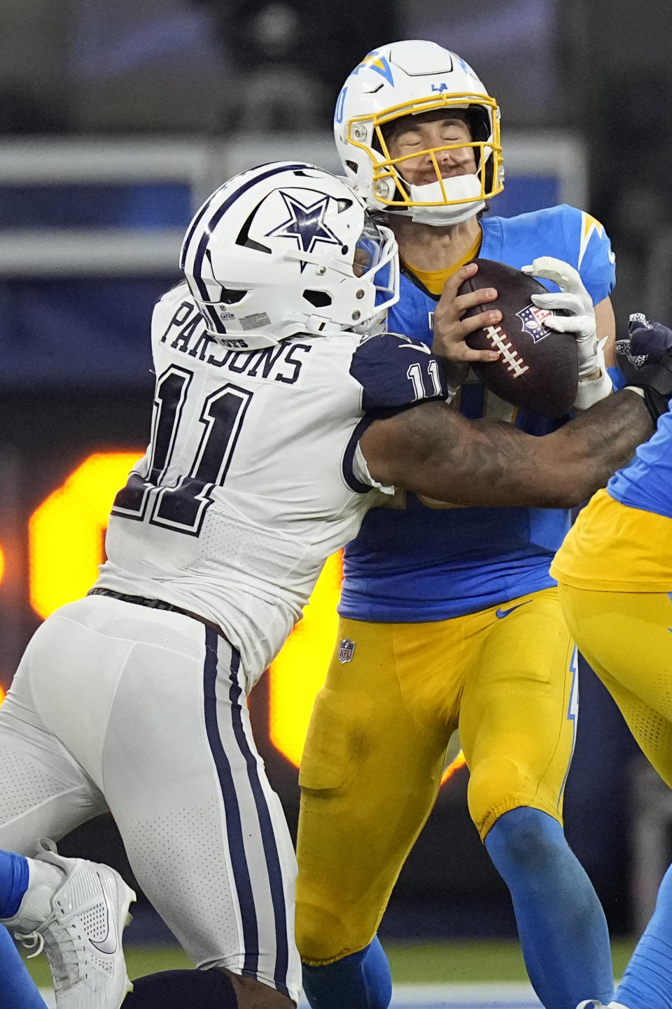 Los Angeles Chargers quarterback Justin Herbert (10) is sacked by Dallas Cowboys linebacker Micah Parsons (11) during the fourth quarter of an NFL football game Monday, Oct. 16, 2023, in Inglewood, Calif. (AP Photo/Mark J. Terrill)