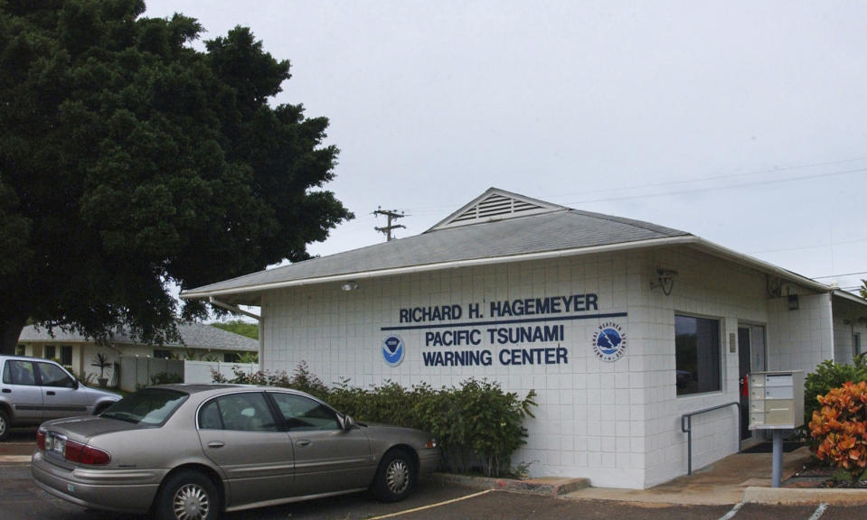 FILE - In this Dec. 30, 2004, file photo, The Pacific Tsunami Warning Center building in Ewa Beach, Hawaii, where geophysicists with the National Weather Service Pacific Tsunami Warning Center, monitor computer tracking systems watching for tsunami, or tidal wave, activity in the Pacific Ocean. The U.S. is giving Native Hawaiians surplus land as compensation for acres that were meant for homesteading but used instead by the government. Officials on Monday, June 14, 2021, said the transfer attempts to help right wrongs against the Indigenous people of Hawaii. It includes Ewa Beach land and helps fulfill terms of a settlement agreement authorized by Congress in 1995. (AP Photo/Ronen Zilberman, File)