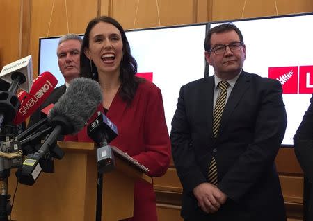 New Zealand Labour leader Jacinda Ardern smiles as she speaks to the press after leader of New Zealand First party Winston Peters announced his support for her party in Wellington, New Zealand, October 19, 2017. REUTERS/Charlotte Greenfield