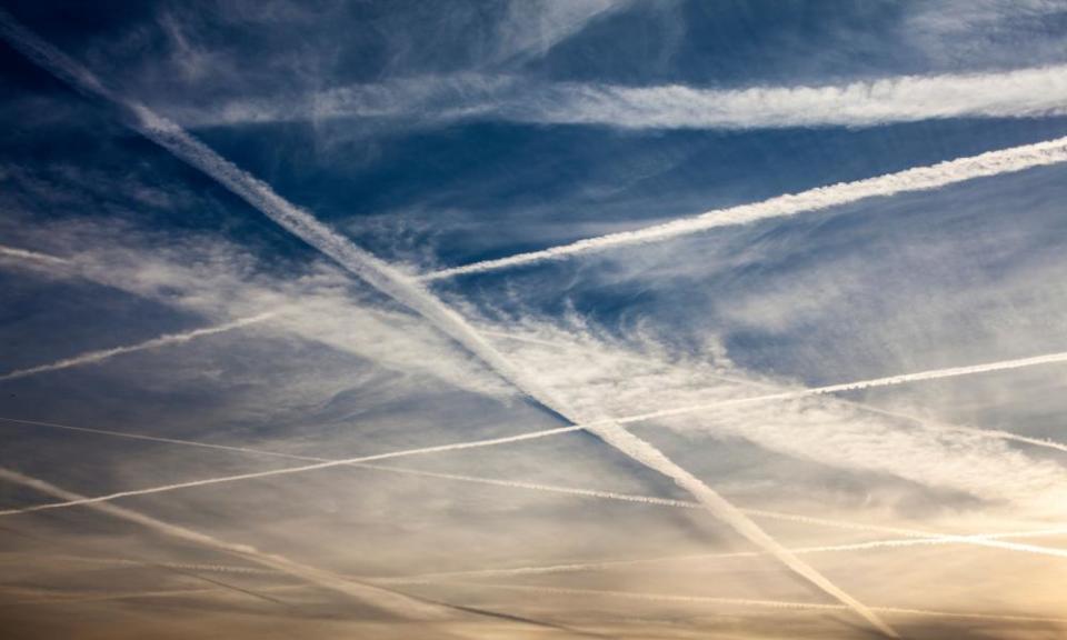 Aircraft vapour trails cover the sky’s over west London on an early Autumn evening.