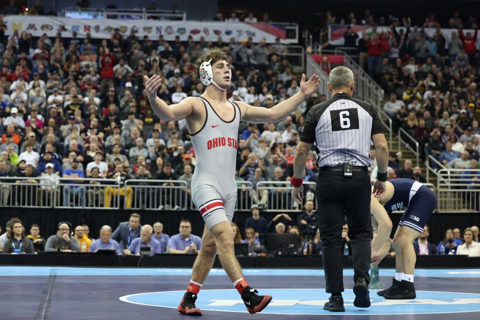 Ohio State's Jesse Mendez celebrates after beating Penn State's Beau Bartlett to win the NCAA 141-pound wrestling title on Saturday.