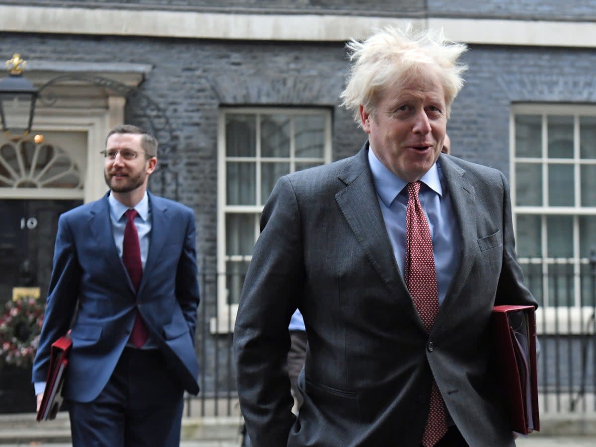 Boris Johnson, accompanied by cabinet secretary Simon Case (PA)