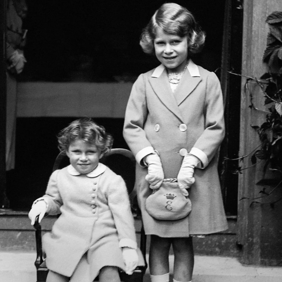 Two-year-old Princess Margaret with her sister Princess Elizabeth in 1933 (PA)