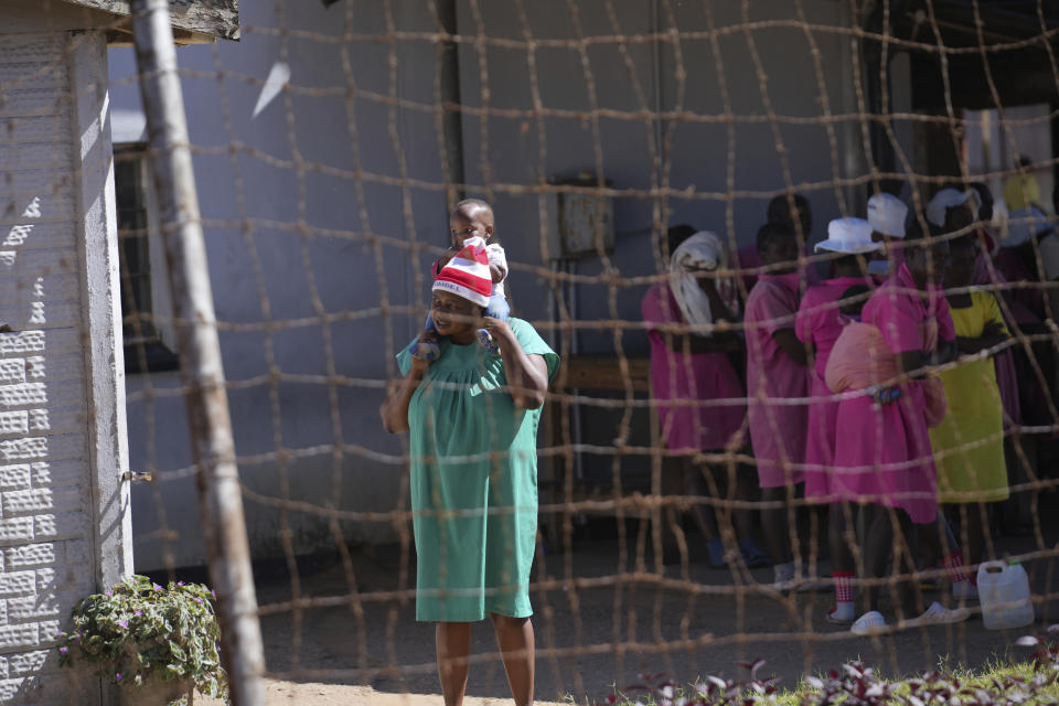 A female prisoner holds her baby inside Chikurubi female prison on the outskirts of the capital Harare, Thursday, April 18, 2024. Zimbabwe President Emmerson Mnangagwa has granted amnesty to more than 4,000 prisoners in an independence day amnesty. The amnesty coincided with the country's 44th anniversary of independence from white minority rule on Thursday and included some prisoners who were on death row. (AP Photo/Tsvangirayi Mukwazhi)