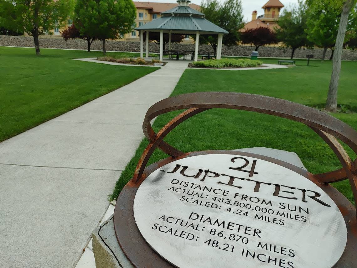 Trevor Macduff, a Richland school teacher, is turning the Mid-Columbia into an 80-mile scale replica of the solar system, with planets orbiting around the “sun” at the REACH Museum in south Richland. Above, the planet Jupiter’s orbit is noted at the north end of Richland’s Howard Amon Park, near a gazebo.