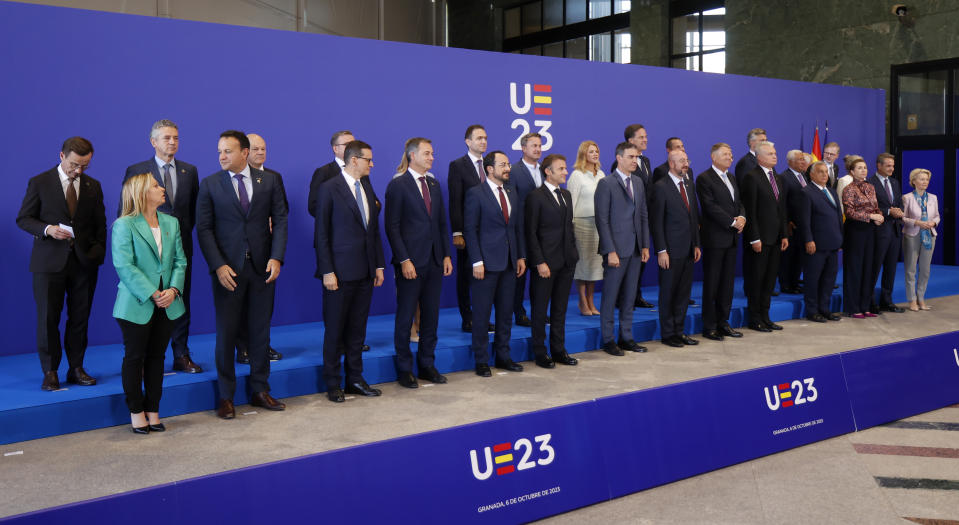 Spain's acting Prime Minister Pedro Sanchez, centre, poses with other heads of state and delegates during a group photo on the second day of the Europe Summit in Granada, Spain, Friday, Oct. 6, 2023. European Union leaders have pledged Ukrainian President Volodymyr Zelenskyy their unwavering support. On Friday, they will face one of their worst political headaches on a key commitment. How and when to welcome debt-laden and war-battered Ukraine into the bloc. (AP Photo/Fermin Rodriguez)