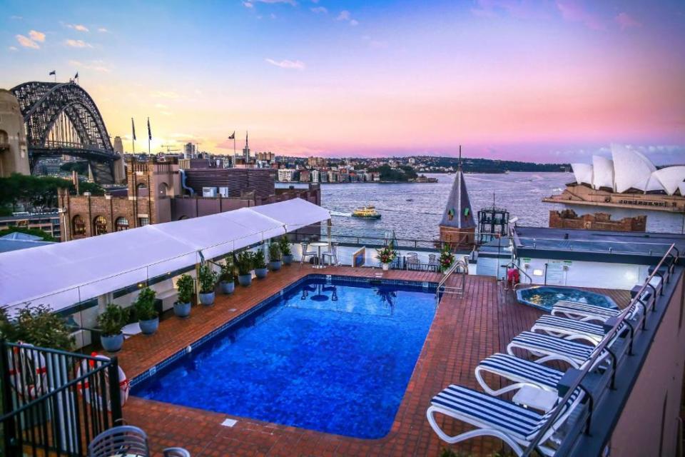 view of NYE fireworks from the rooftop pool at Rydges Sydney Harbour hotel