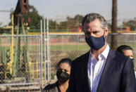 California Gov. Gavin Newsom speaks near oil fields by the Wilmington Boys & Girls Club Thursday, Oct. 21, 2021, in Wilmington, Calif. California's oil and gas regulator on Thursday proposed that the state ban new oil drilling within 3,200 feet of schools, homes and hospitals to protect public health in what would be the nation's largest buffer zone between oil wells and communities (Hunter Lee/The Orange County Register via AP)