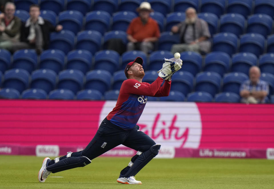 England's Jonny Bairstow takes a catch to dismiss Sri Lanka's Kusal Mendis off the bowling of England's Mark Wood.during the second T20 international cricket match between England and Sri Lanka in Cardiff, Wales, Thursday, June 24, 2021. (AP Photo/Alastair Grant)