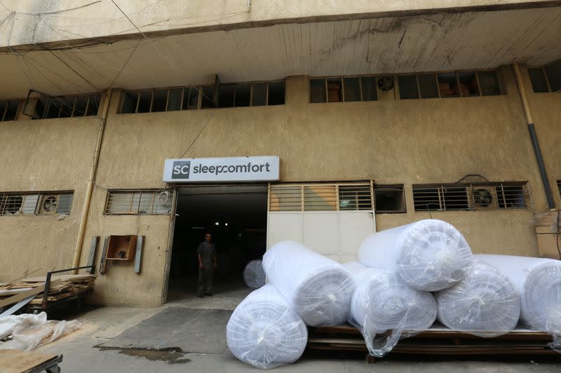 A man is pictured at Sleep Comfort furniture factory that was damaged during Beirut port blast