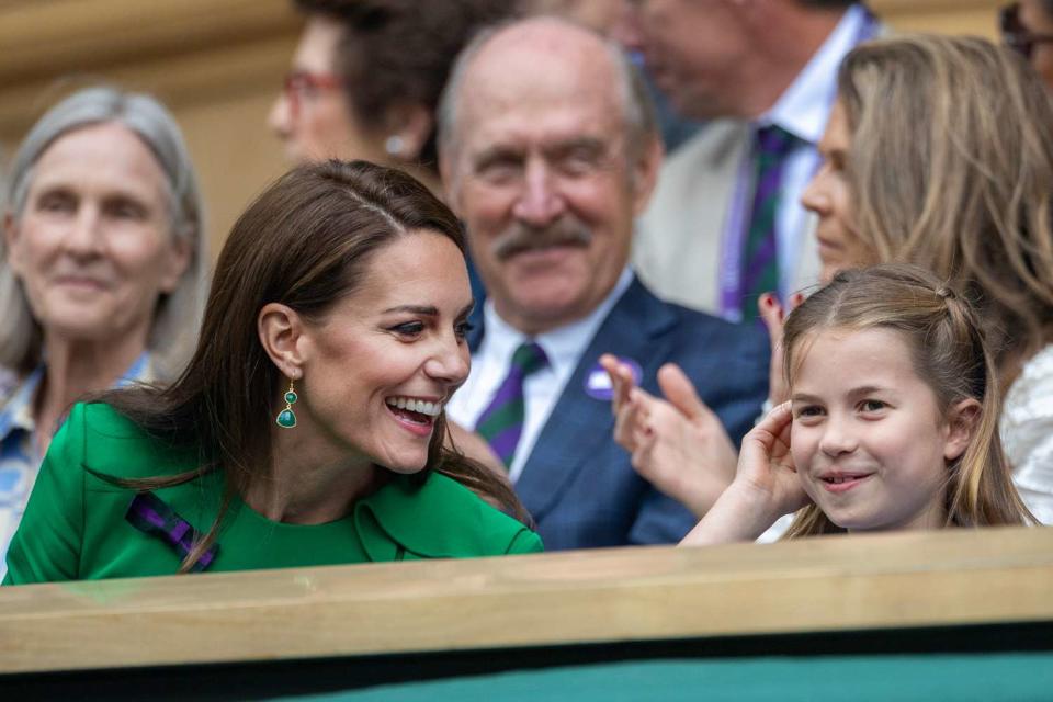 <p>Tim Clayton/Corbis via Getty </p> Kate Middleton and Princess Charlotte attend Wimbledon in July 2023