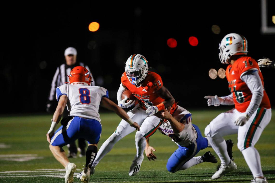 Frederick Douglass’s Ty Bryant (13) breaks through traffic to score a touchdown against Southwestern on Nov. 19, 2021.