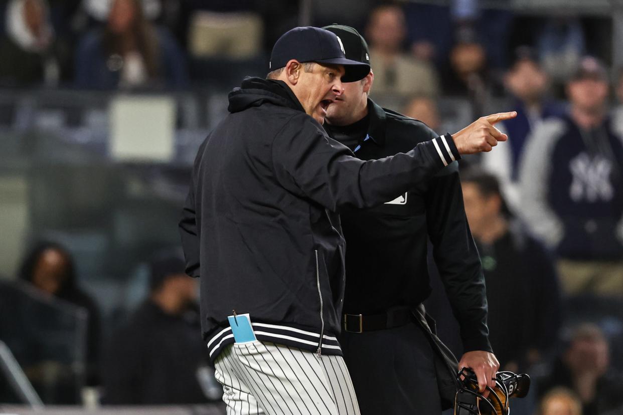 Apr 10, 2024; Bronx, New York, USA; New York Yankees manager Aaron Boone (17) argues with umpire John Bacon (70) after getting ejected in the seventh inning against the Miami Marlins at Yankee Stadium.