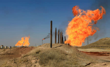 Flames emerge from flare stacks at the oil fields in Kirkuk, Iraq October 18, 2017. REUTERS/Alaa Al-Marjani/Files