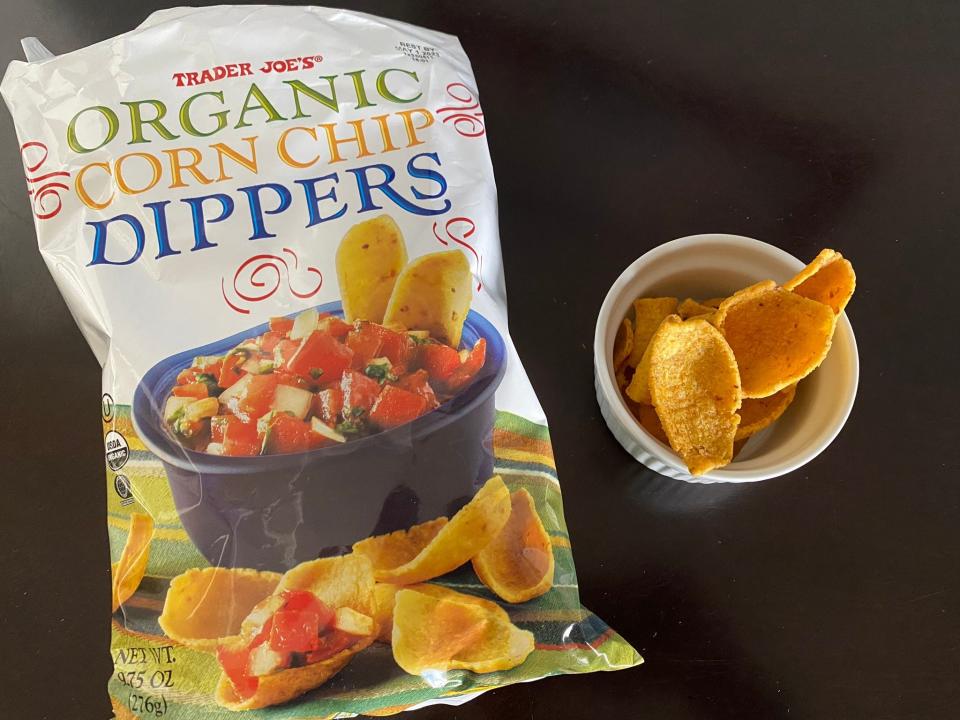 Bag of Trader Joe's corn-chip dippers next to a small bowl of dippers