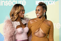 <p>Yvonne Orji and Issa Rae smile at the final season premiere of <em>Insecure </em>on Oct. 21 in L.A. </p>