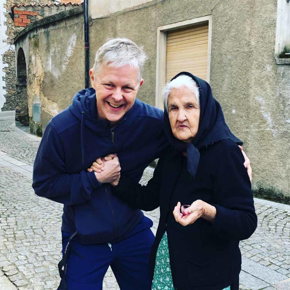 Chris with the widow Maria in Sardinia, where there are no old age homes. PA REAL LIFE