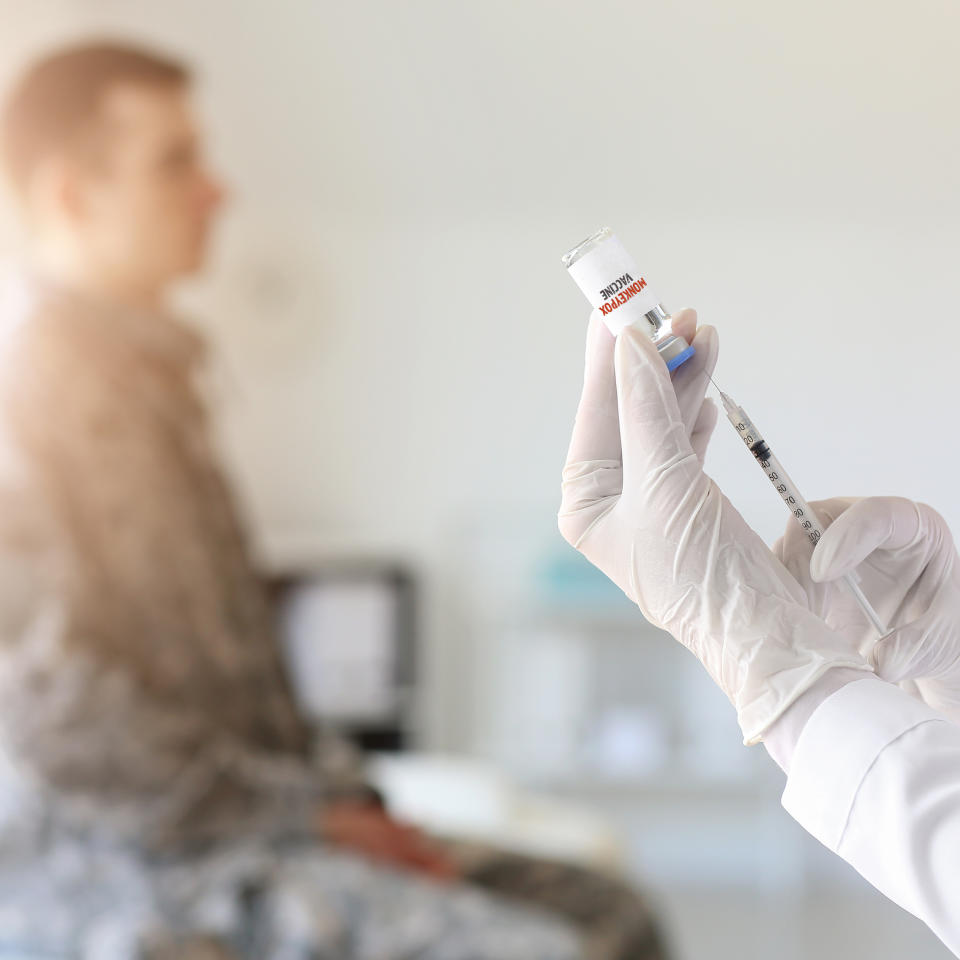 Doctor vaccinating patient against monkeypox in clinic