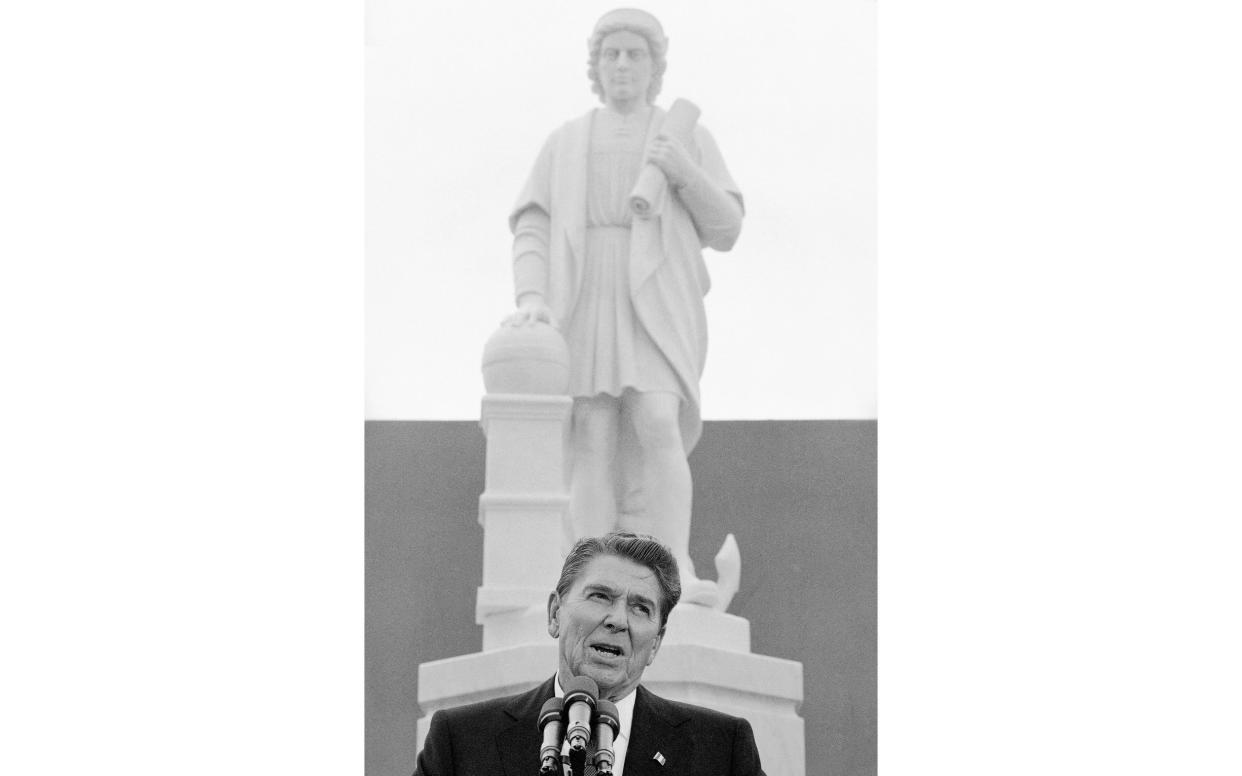 President Ronald Reagan addresses a ceremony in Baltimore, to unveil a statue of Christopher Columbus - AP